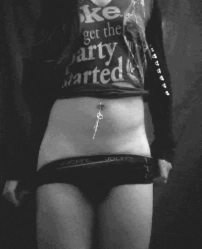 You take your panties off, slowly revealing your hard cock with it.