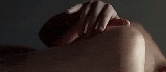 Rub her shoulder