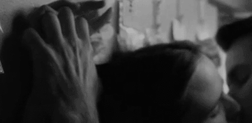 Kissing pinned to the wall