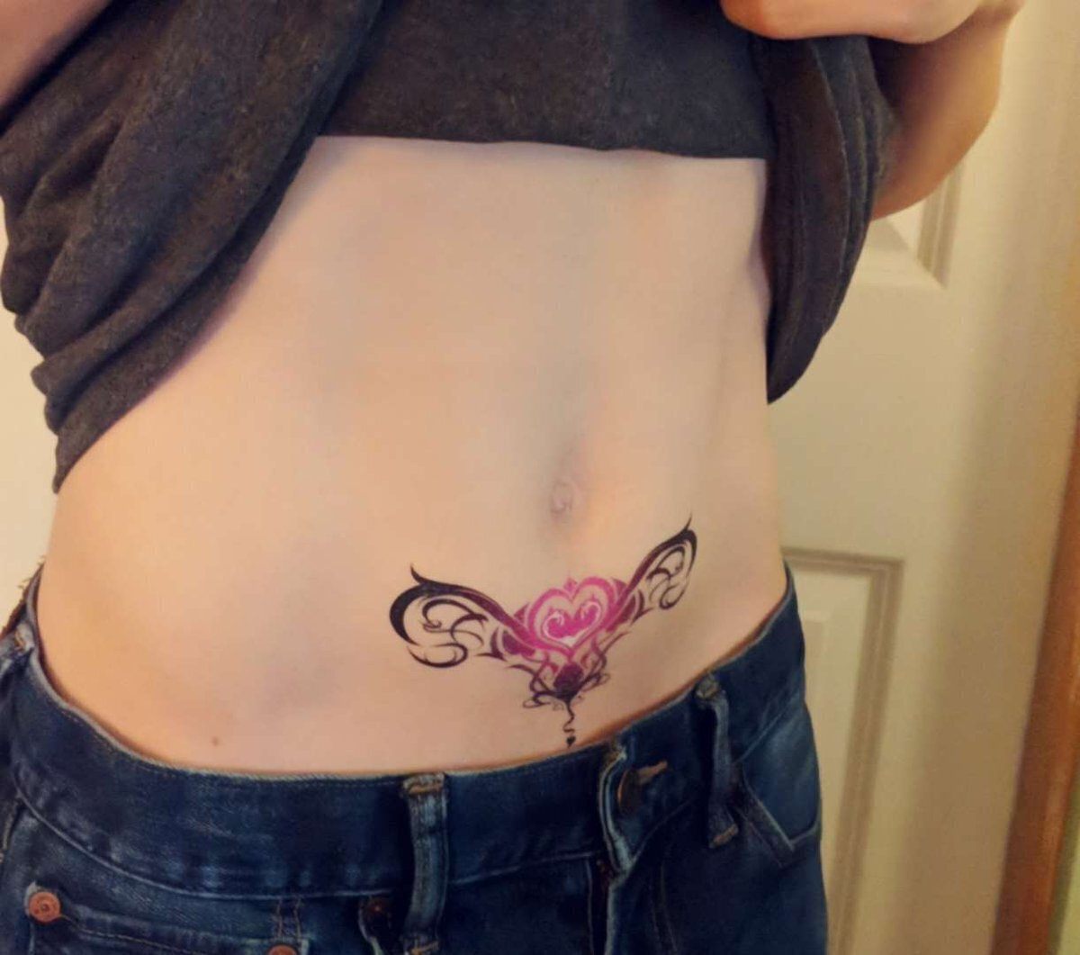 Reveal your womb tattoo