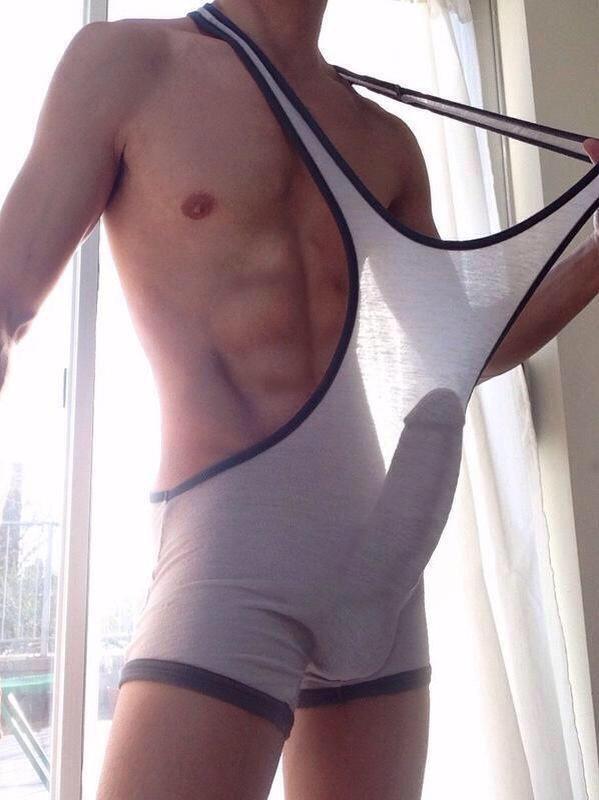 Pull singlet to show your cock shape