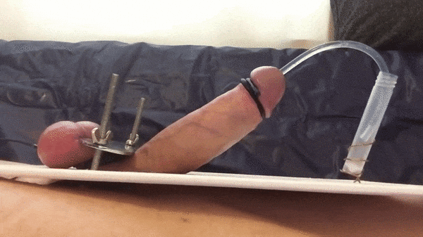 You watch as he goes over the edge and shoots his seed though the catether and into the container, filling it with cum to be used later for whatever hits your fancy then.