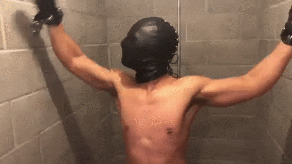 He lost, so now you get to do whatever you want with him. Binding him to the shower walls, you also put a leather hood on his head before you slowly you begin to turn the knob.