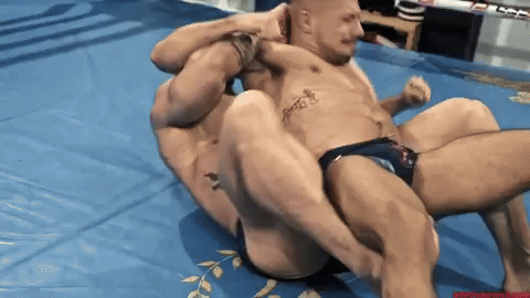 You get you opponent in a full nelson hold and stretch his legs out, leaving nothing to the imagination!