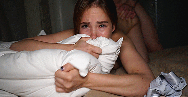 With a pillow pressed tightly against your mouth, you muffle your own moans as he thrusts into you. Each movement makes you bite down on the fabric, trying to stifle the sounds that escape. Your body pushes back against him instinctively, your muffled gasps growing louder as the pleasure builds.