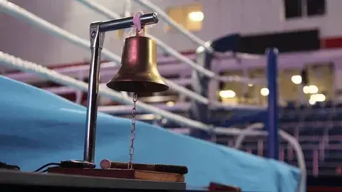 The ref rings the bell.  Match over! 