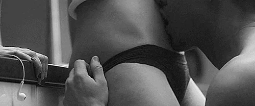 As you remove her underwear, her panties are replaced by your lips with a kiss of her clit.
