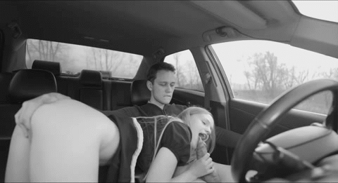 You slide your hand down to her ass, fingers slipping into her pussy, stroking her wet folds as passersby move just outside the tinted windows. Simultanously she gets down on your cock, her lips wrapping around you, sucking eagerly while the risk of being seen fuels your thrusts.