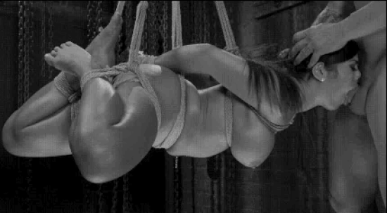 What's better than a good blowjob? Fucking her face while she helplessly dangles in the air! You hoist her up and start to use her mouth like a cocksleeve.
