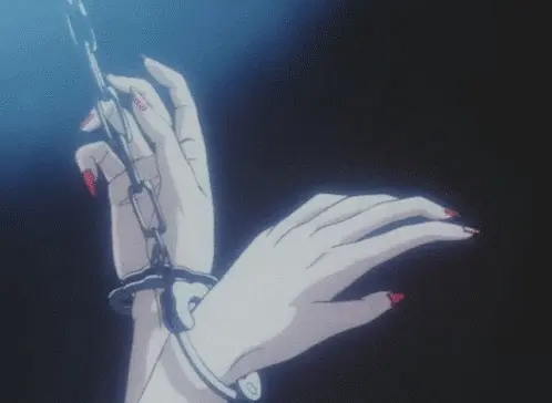 Befestige die Handschellen.