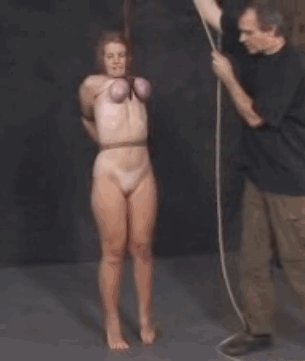 You tie them with ropes tightly around her tits. You watch and laugh as she realizes what you are going to do.