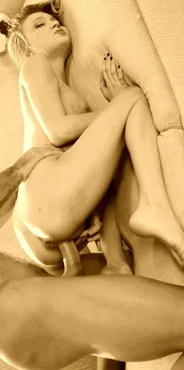 As you are thrusting, you see her drop her face in the sheets; muffling her moans.