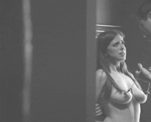 Holding onto the clamps pinching at her swollen nipples, you pull her body up to yours. She lets out a gasp from the shock, reminded of who is in charge.