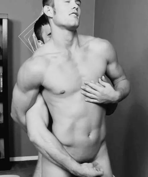 You pull him against you so he can feel your hard cock against his back. Reaching around your hand grips his throbbing cock and slowly starts stroking him, gliding up and down his cock which starts to leak, dripping precum as he struggles to resist your teasing.