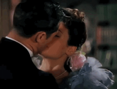 You take her by surprise and kiss her.