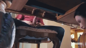 Jerk his cock under the table