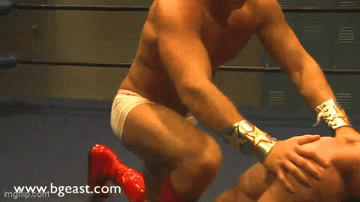 Pull his arms back while kneeling on his back