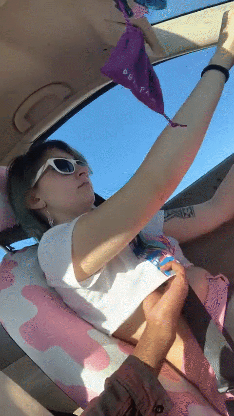 Grope breasts while she drives